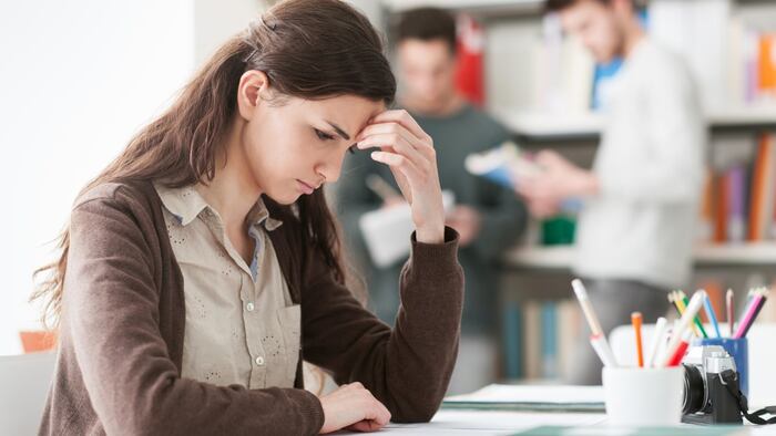 Young female student with headache