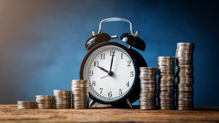 business financial ideas concept with coins stack and alarmclock isolate background with free copyspace for your creativity ideas text