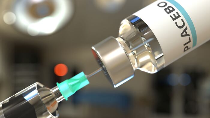 Vial with placebo medicine and syringe for injection