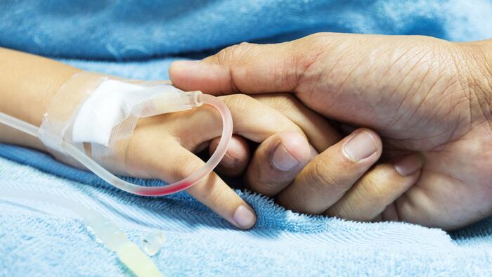 IV solution in a child's patients hand