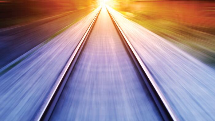 train fast run on railway track in sunny day