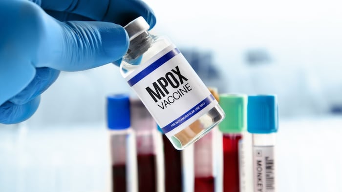 Doctor with vial of the doses vaccine for MPOX monkeypox disease