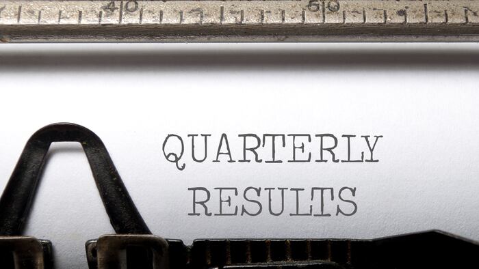 Quarterly resluts on typewriter close up