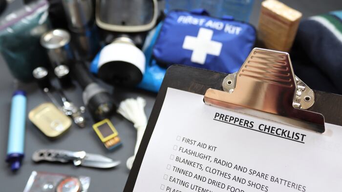 Clipboard checklist.Preppers are know for preparing for natural disasters,economic collapse,civil unrest or any doomsday scenario Such items would include food,water,lighting,shelter,and first aid kit