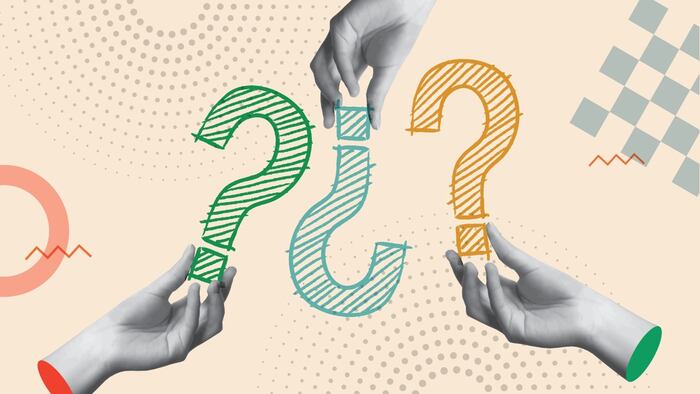 hands holding question marks