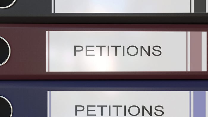 Vertical stack of multicolor office binders with Statements tags 3D rendering