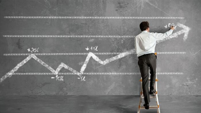 Businessman draws a statistical trend line