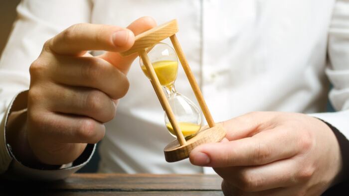 Man holding hourglass in hands
