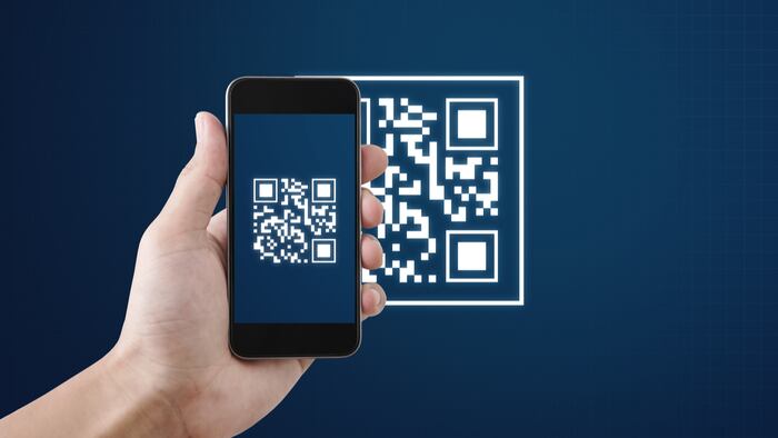 QR code scanning payment and verification. Hand using mobile smart phone scan QR code