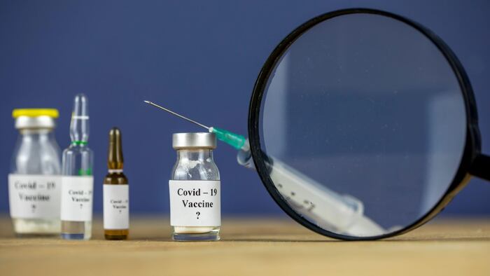Vaccine under a magnifying glass