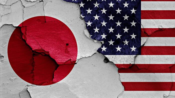 Japan And US Flags On Cracked Wall