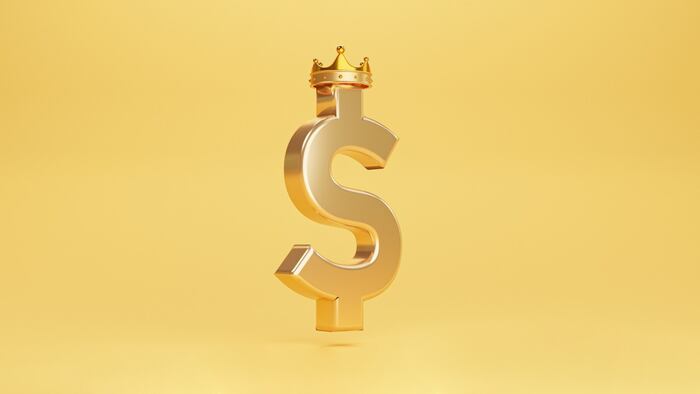 Dollar sign wearing crown with gold background
