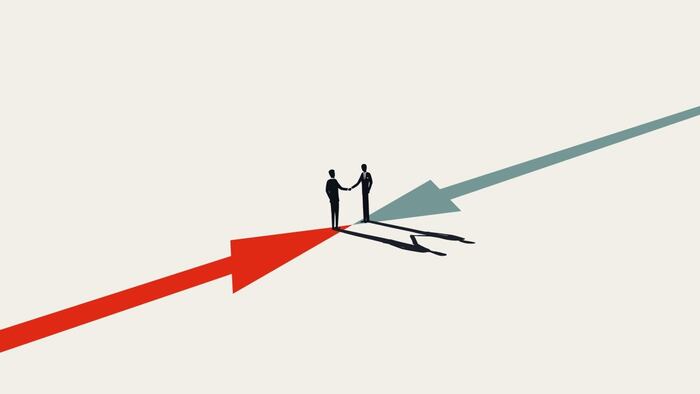Two figures shaking hands, business deal concept
