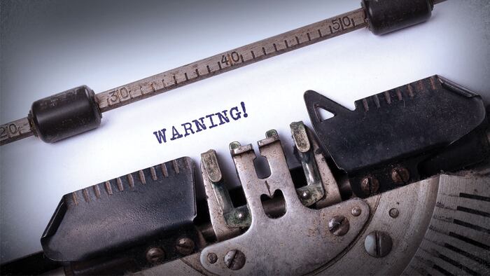 Vintage inscription made by old typewriter, warning