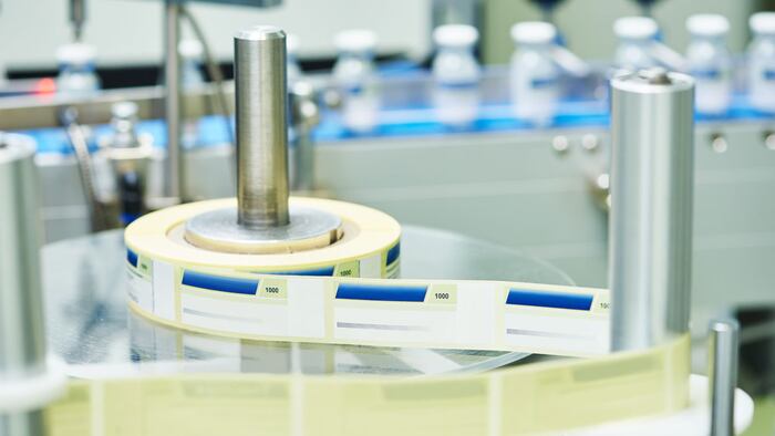 ine conveyor for labeling and packaging ampoules in boxes