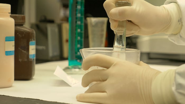 Side view of titration in a compounding pharmacy