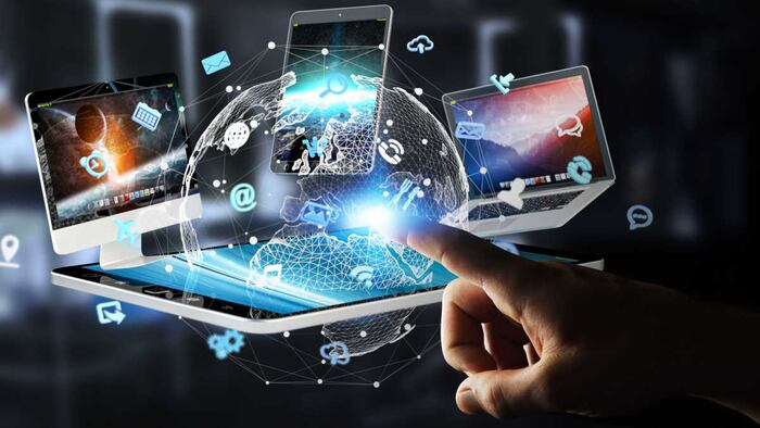 Businessman on blurred background connecting tech devices 3D rendering