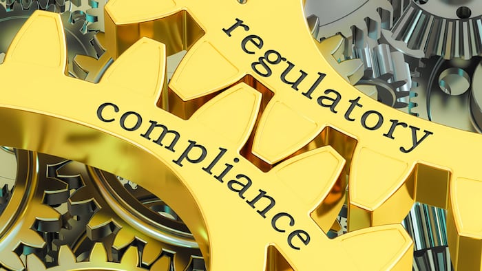 regulatory compliance concept on the gearwheels, 3D rendering