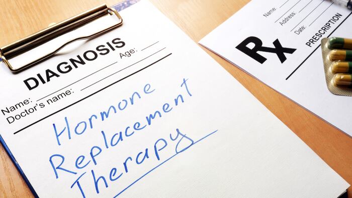 Clipboard with medical form and sign Hormone Replacement Therapy. - Image