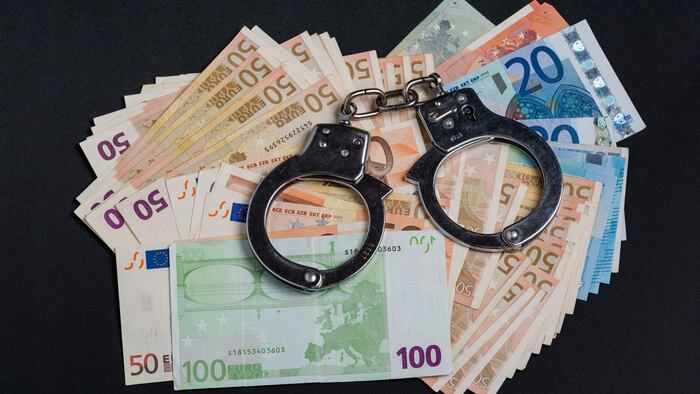 Money and handcuffs