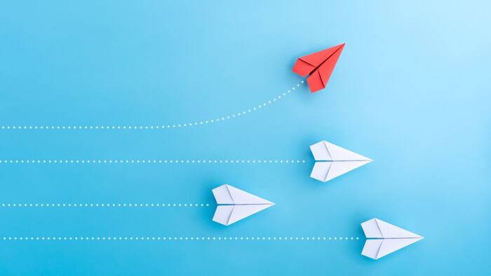 Paper planes red break away from pack