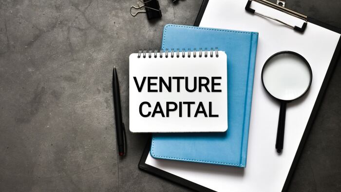 Notepad with "venture capital" written on it