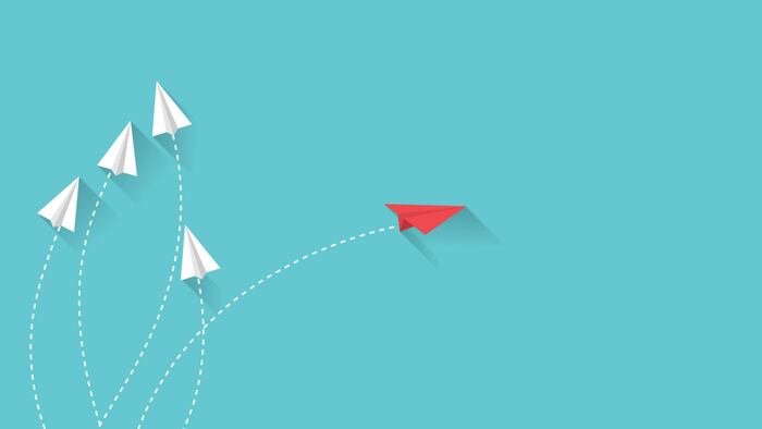 Red paper plane is different from the white paper plane. business and leadership concept. airplane change direction.