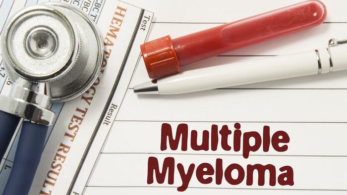 Diagnosis of Multiple Myeloma. Test tubes or bottles for blood, stethoscope and laboratory hematology analysis surrounded by text title of diagnosis of Multiple Myeloma lie in the doctor workplace