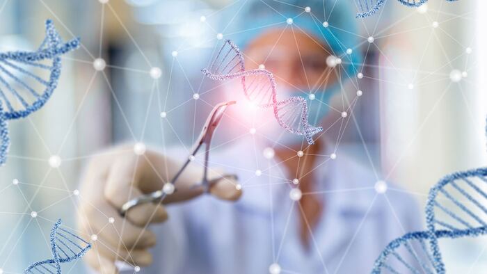 Researcher working with DNA on blurred background.
