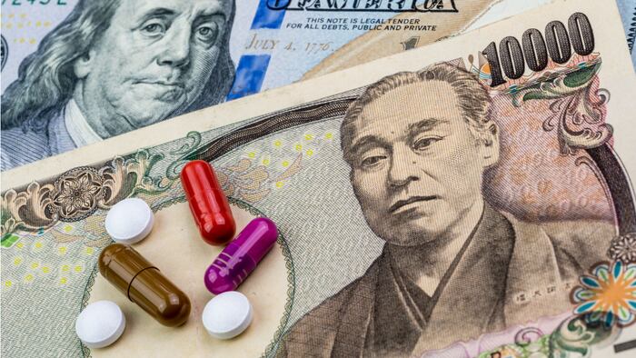 Stack of pills on top of JPY10,000 note