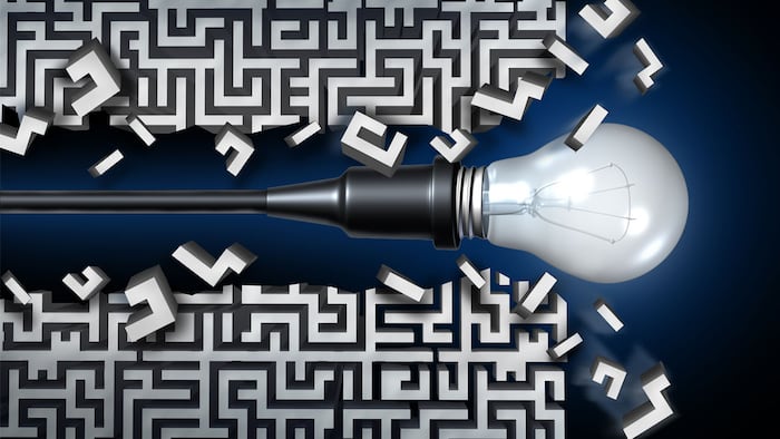 Innovative idea solution concept and new thinking business symbol as a light bulb breaking through a maze or labyrinth as an icon for innovation and invention. - Illustration