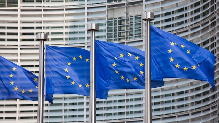European flags in front of the Berlaymont building, headquarters of the European commission in Brussels