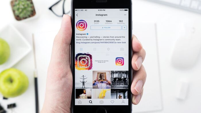 CHIANG MAI, THAILAND - May 14,2016: A man holds Apple iPhone with Instagram application on the screen. Instagram is a photo-sharing app for smartphones.