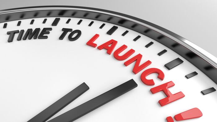 Clock with words time to launch on its face