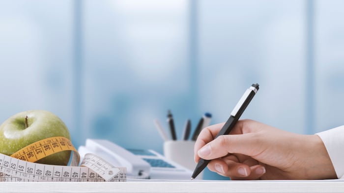 Nutritionist sitting at her desk