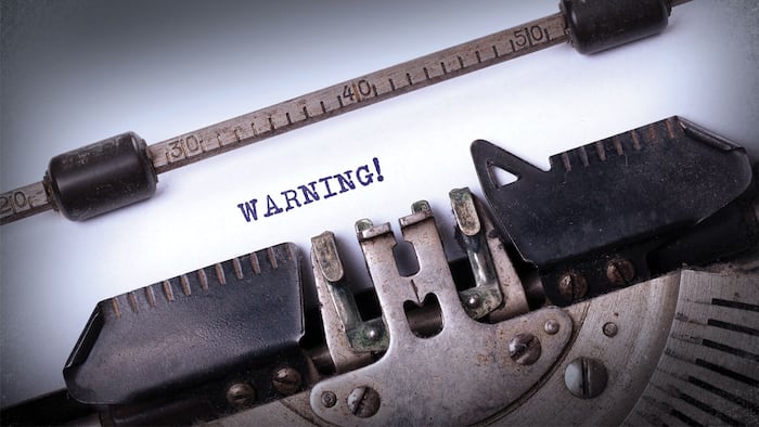 Vintage inscription made by old typewriter, warning