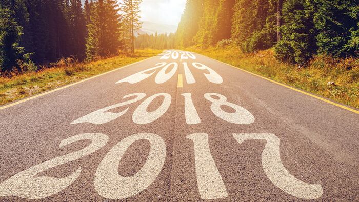 Empty asphalt road and New year 2018, 2019, 2020 concept. Driving on an empty road in the mountains to upcoming 2018, 2019, 2020 and leaving behind old years. Concept for success and passing time.