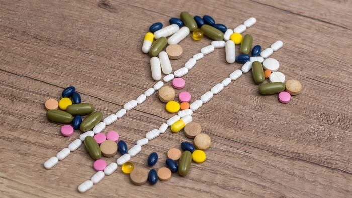 Dollar sign made with drug pills