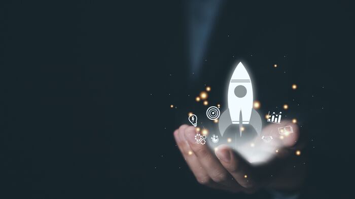 hand shows a rocket and an icon