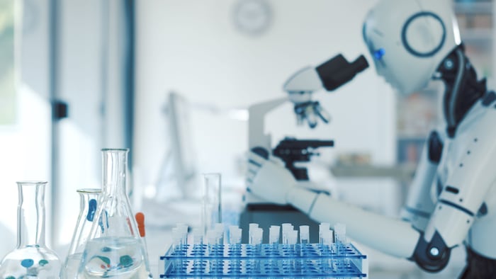 robot looking at microscope
