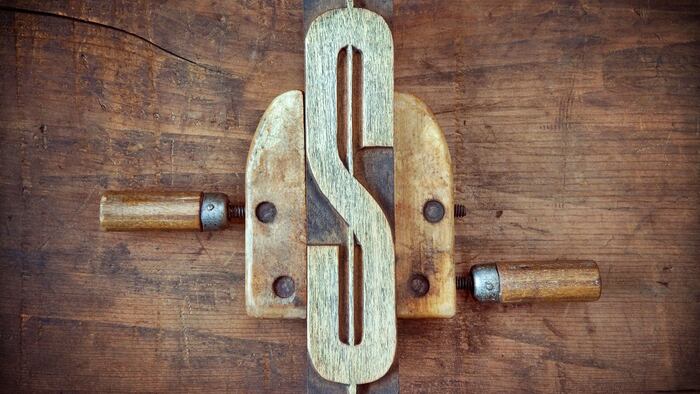 Dollar Sign in Vise Vice Price Squeeze