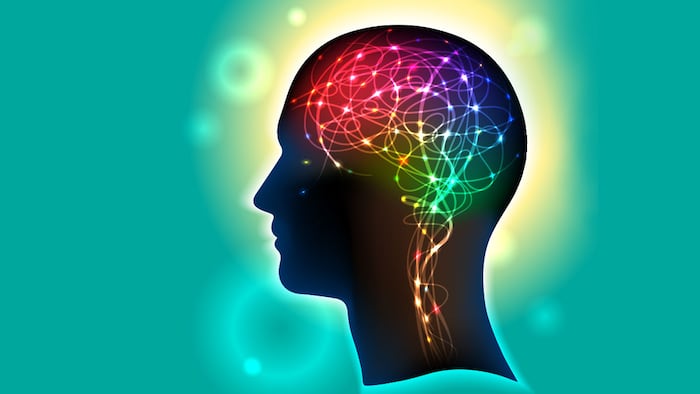 Profile of a human head with a colorful symbol of neurons in the brain
