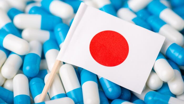 Small Japanese flag amid generic pills