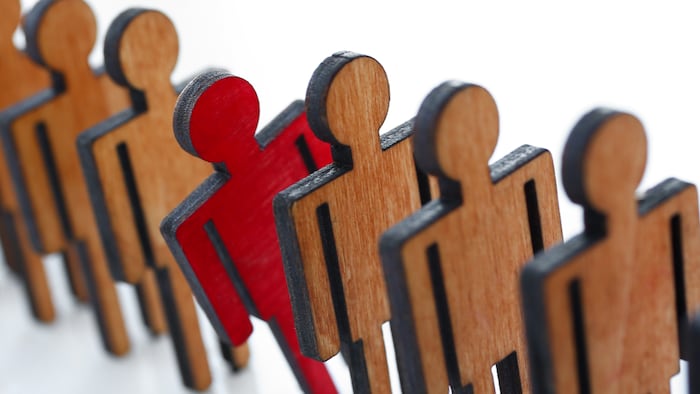 Male red plastic toy businessman silhouette wooden figure background closeup. Manipulate work recruitment transfer labour inspectorate experience exchange man hr worker subordination human concept