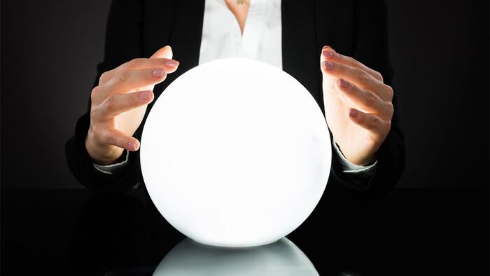Businesswoman Hands On Crystal Ball On Black Background. Fortune Teller Predicting Future