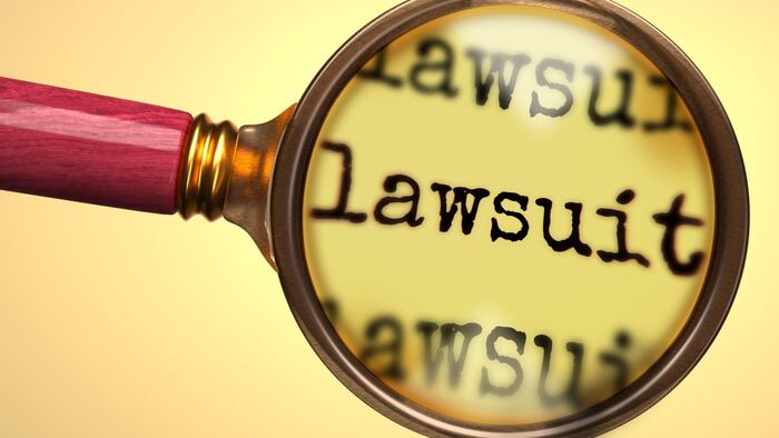 Lawsuits magnifying glass