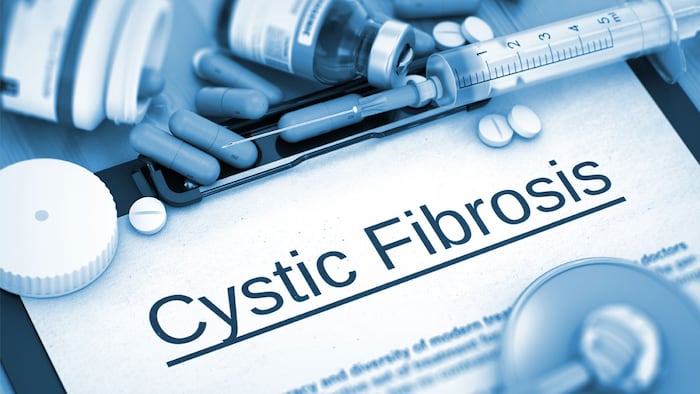 Cystic Fibrosis, Medical Concept with Pills, Injections and Syringe. Cystic Fibrosis - Printed Diagnosis with Blurred Text. 3D Render.