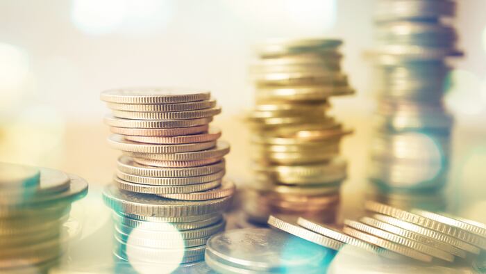 rows of coins and blurred bokeh for finance and banking concept - Image
