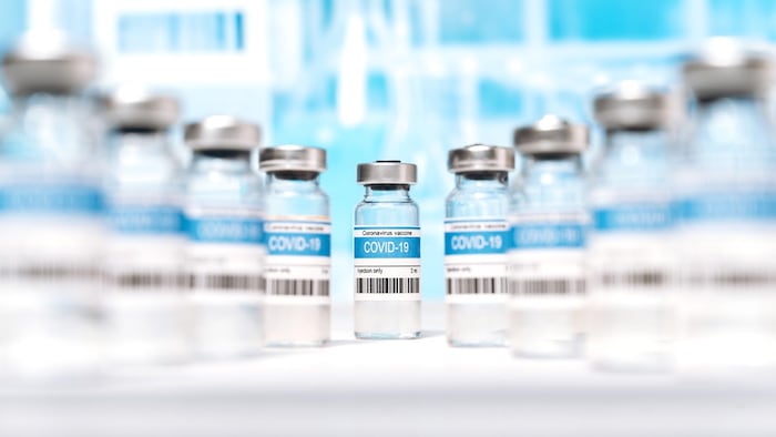 Coronavirus vaccine manufacture, worldwide vaccination and healthcare concept