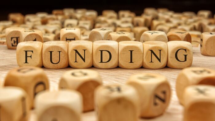 FUNDING word written on wood block